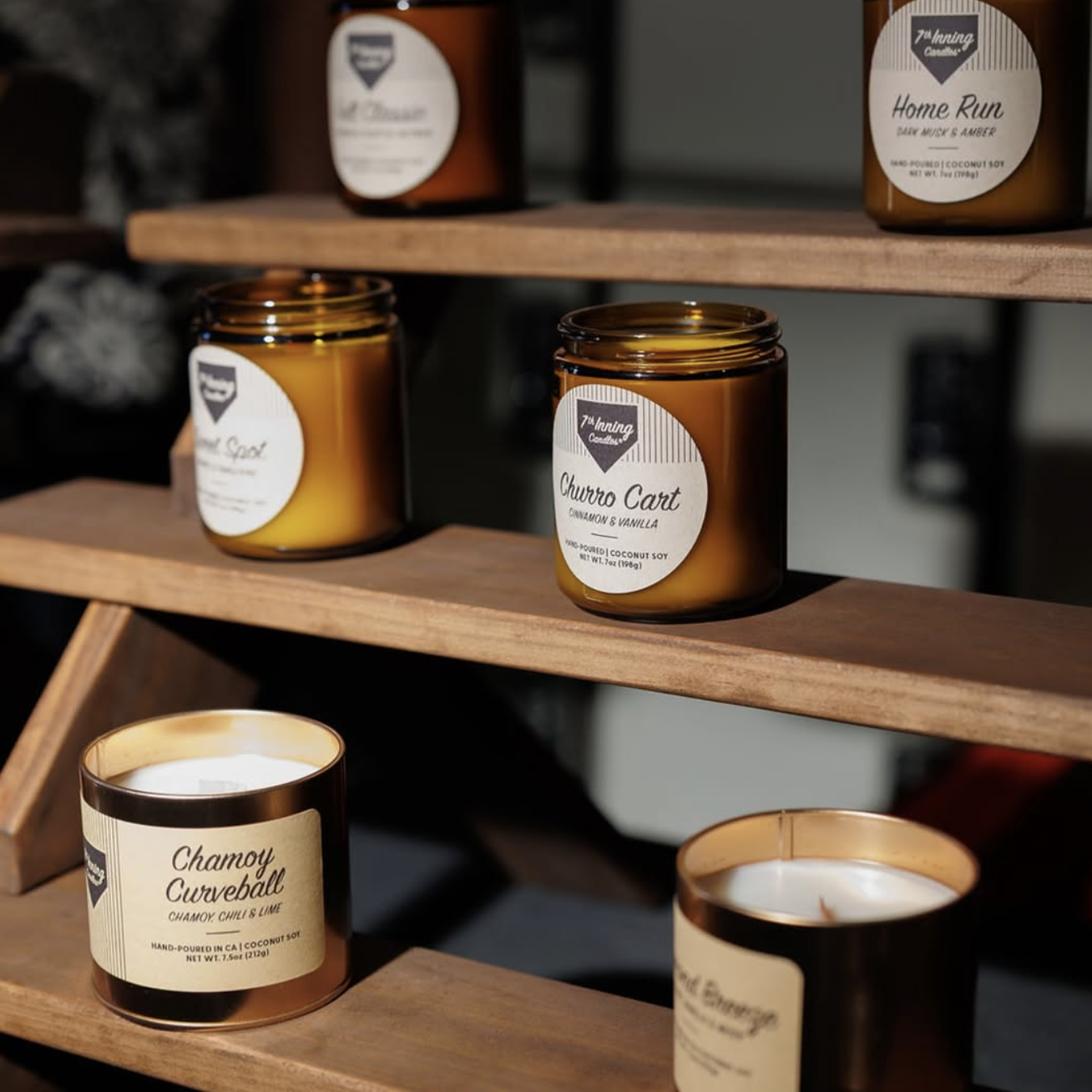 Top down view of rice, cardamom, and star anise on gray fabric.